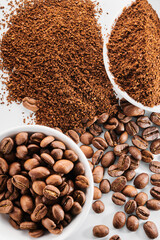 Roasted coffee whole and ground beans in bowl isolated close up on white background