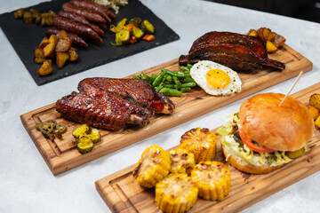 meat and vegetables on the grill, collage with grilled food, grilled meat, barbecue day banner 