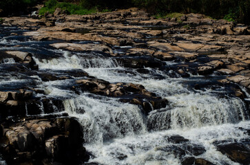 Waterfall of Piracicaba River. River almost dry. River with visible stones. River of a turistic place.