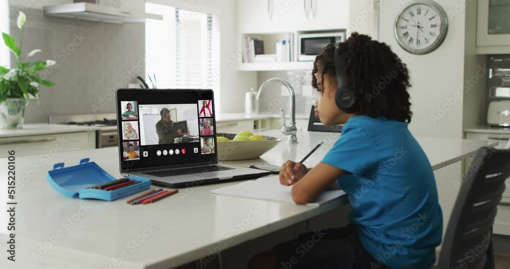 Canvas Prints African american boy using laptop for video call, with male teacher and class on screen