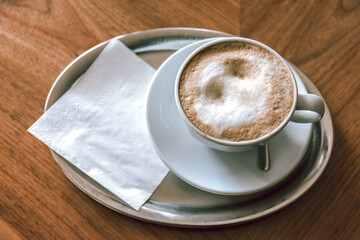 cappuccino on a plate with a napkin