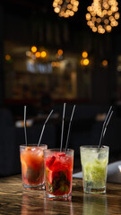 red orange and green cocktails in the dark background light for your coffee house menu with free space for you text