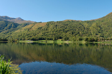Fototapeta na wymiar Calm mountain lake in the tourist area in Saint Lary village, ‎⁨Saint-Lary⁩, ⁨Midi-Pyrenees⁩, ⁨France⁩