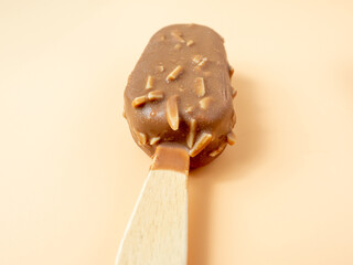 Chocolate Ice Cream with almonds on a stick.
