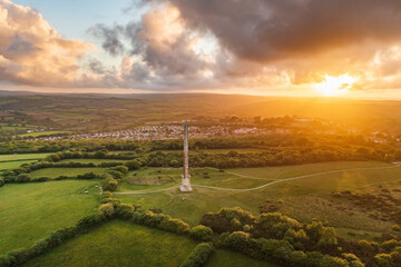 Aerial view of Bodmin Beacon during a dramatic sunset over the beautiful countryside of inland, Lanhydrock, Bodmin, Cornwall, United Kingdom.