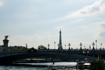 Fototapeta na wymiar Views from the Seine River to the Bridge Alexander III and the Eiffel Tower