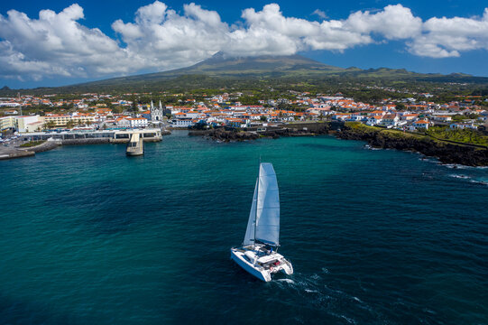 Aerial View of Sailboat while sailing in a regatta off the coast on Pico Island, Azores, Portugal.