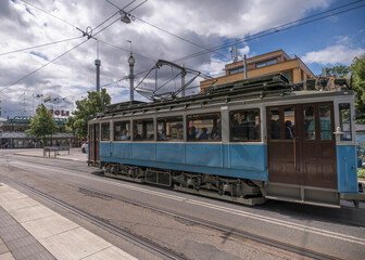 Old tram type A1 in duty on the line in the island Djurgården at the stop ABBA museum and Tivoli,...