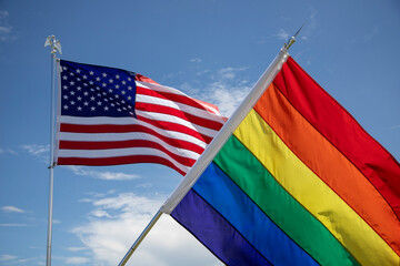 The United States Flag along with the Pride Rainbow flag at a rally in Florida