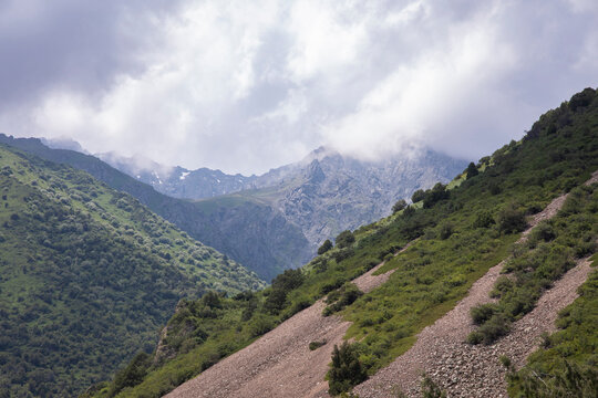 View of the Tian Shan Mountains with storm clouds, in Kyrgyzstan.