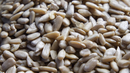 Lots of peeled sunflower seeds close-up, full frame.