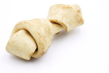 Carnaza bone for dogs to bite on, on a white background