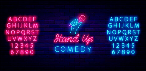 Stand up comedy neon signboard. Hand with microphone. Shiny blue and pink alphabet. Vector stock illustration