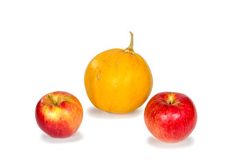 Ripe apples and pumpkin on white background