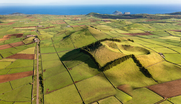 Aerial view of the volcanic island Terceira with fields and houses, Azores, Portugal.