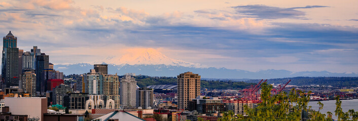 City skyline panorama with Mount Rainier at sunset in Seattle, Washington