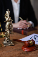 justice and law concept.a female judge in a courtroom on a wooden table and a Counselor or female...