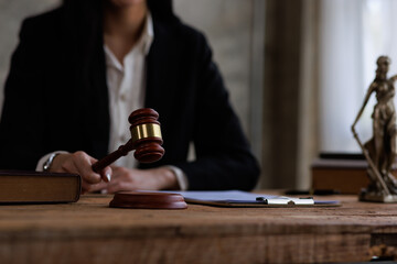 justice and law concept.a female judge in a courtroom on a wooden table and a Counselor or female lawyer working in an office. Legal law, advice, and justice concept.