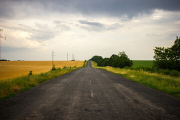 Road with a dark rainy sky.
