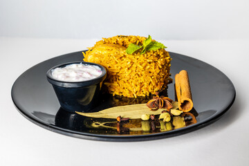 Chicken biryani Spicy Indian Malabar biryani Hyderabadi biryani pulao with egg. Beautiful shot of Kerala India Sri Lanka style biriyani made of basmati rice