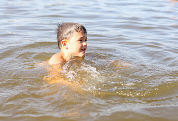 Fototapeta na wymiar child playing in the water