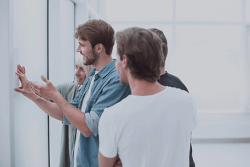 Fototapeta premium close up. creative team of colleagues standing in the office.