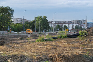 redevelopment of a street in the city, you can see excavated areas and blocks of flats, Wrocław,...