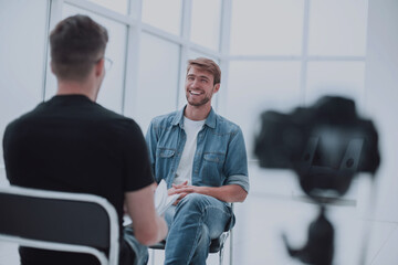 two young men talking in the TV Studio