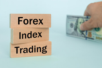 wooden blocks with the words Forex, index, trading, Concept, non-stock currency market, money exchange of the most important world institutions