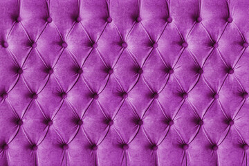 Purple capitone checkered soft fabric textile decorative background with buttons. Classic retro Chesterfield style, luxurious upholstery buttoned texture for furniture, wall, headboard, sofa, couch