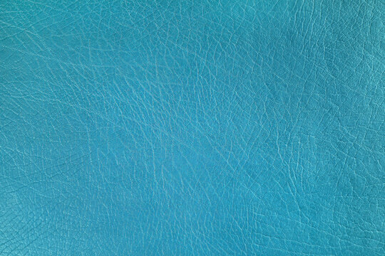 Natural, artificial turquoise leather texture background. Material for sport items, clothes, furnitre and interior design. ecological friendly leatherette.