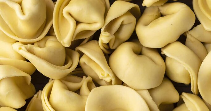 Closeup of uncooked italian pasta cappelletti or tortellini