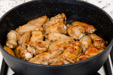Roasted chicken legs in pan