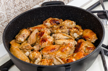 Roasted chicken legs in pan