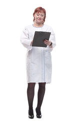 in full growth. competent female doctor with clipboard .