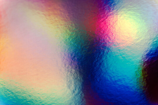 Colorful holographic iridescent holo bg texture, blue, pink and green abstract background
