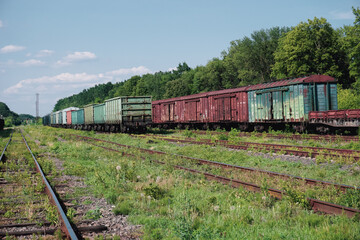 Fototapeta na wymiar Lots of old train cars. Train depot.
