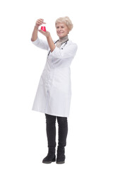 in full growth. female doctor with a laboratory flask .