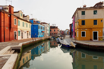 Fototapeta na wymiar Street with colored houses on the island of Burano in the morning. Italy.