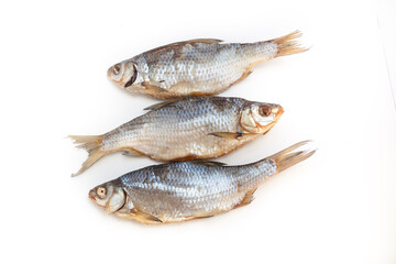 Dry fish. Seafood snack for beer. Salted sun-dried, jerked or smoked fish. Taranka, vobla. Russian or Ukrainian food. Caspian roach fish. Dead fish. High resolution photo. On white background