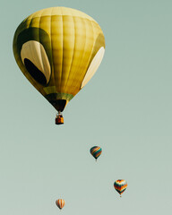 Fototapeta premium Hot air balloons flying in the blue sky