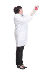 in full growth. senior female doctor with a laboratory flask .