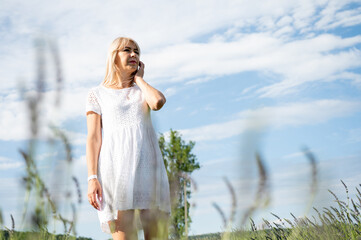 beautiful, young beautiful girl in a white summer dress on a lavender field, summer, rest, emotions, look
