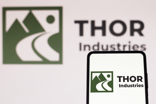 July 5, 2022, Brazil. In this photo illustration, the Thor Industries logo is displayed on a smartphone screen and in the background.