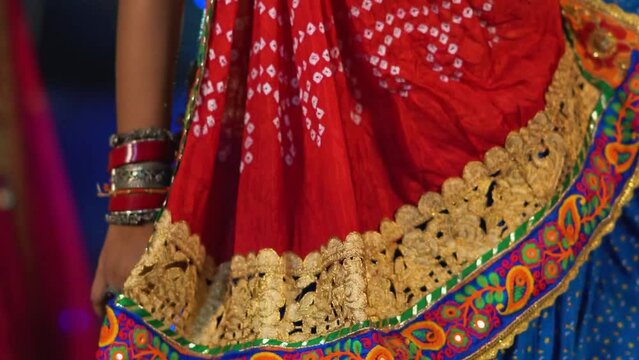 Woman Dancing and Swirling her Dress, Colorful Designer traditional Garba (cultural dance) outfit, Indian traditional dress of woman, girl Twirling or Spinning dress