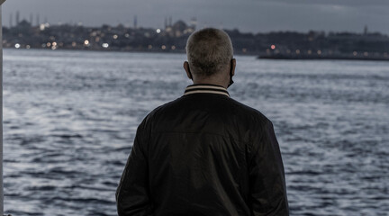 man looking at the sea