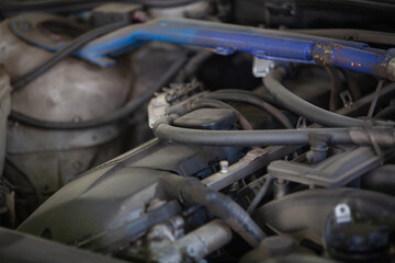 Car engine under the hood of a car