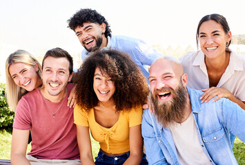 Obraz premium Cheerful Group of friends posing for a photo and having fun. Friendship and community concept