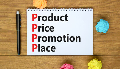 PPPP product price promotion place symbol. Concept words PPPP product price promotion place on the note on beautiful wooden background. Business and PPPP product price promotion place concept.