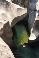 Beautiful view to rocky scenario with river cutting through stones
